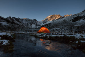 Sleeping in a tent at the start of the winter in the Fundustal, Ötztal, Tyrol, Austria Sleeping in a tent at the start of the winter in the Fundustal, Ötztal, Tyrol, Austria